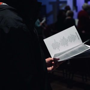 person standing while reading ook